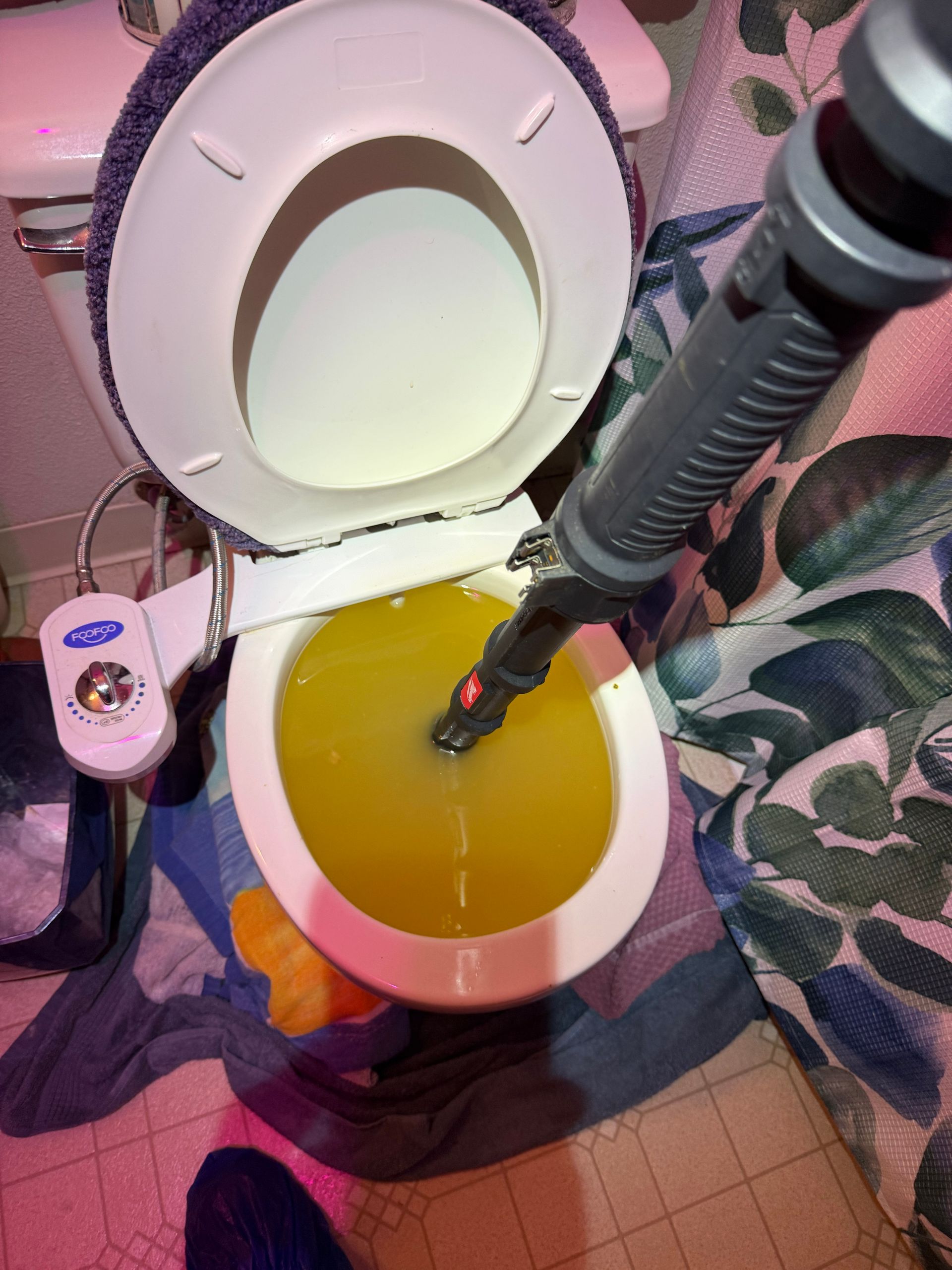 Maxwell Plumbing working on a clogged toilet in Vancouver, WA