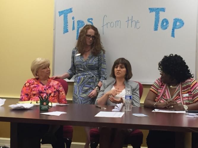 Four women at a table, one standing. Text above reads