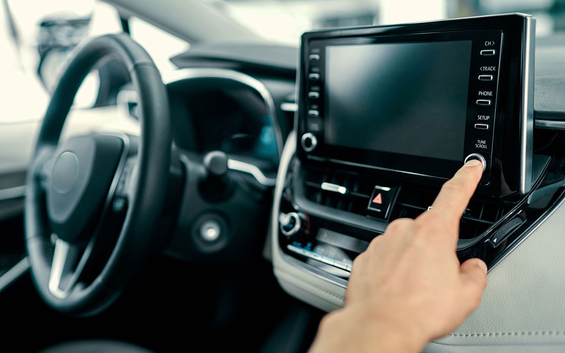 Transportation and vehicle concept - man using car audio stereo system