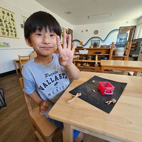 montessori child working with craft activity