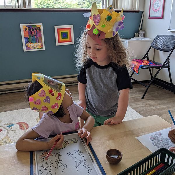 montessori child working with craft activity