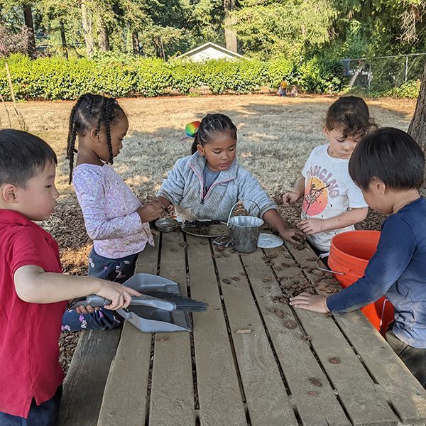 Montessori children working in the garden