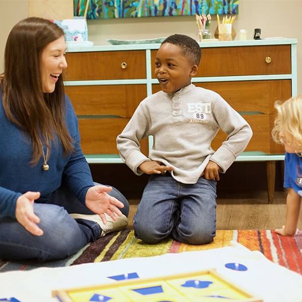 montessori guide and children in the classroom 