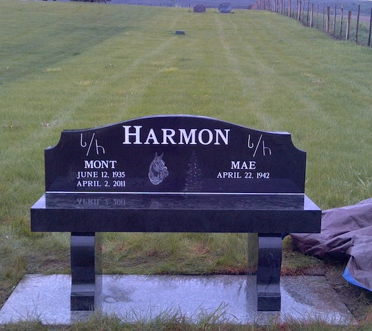 Black granite bench-style headstone with 