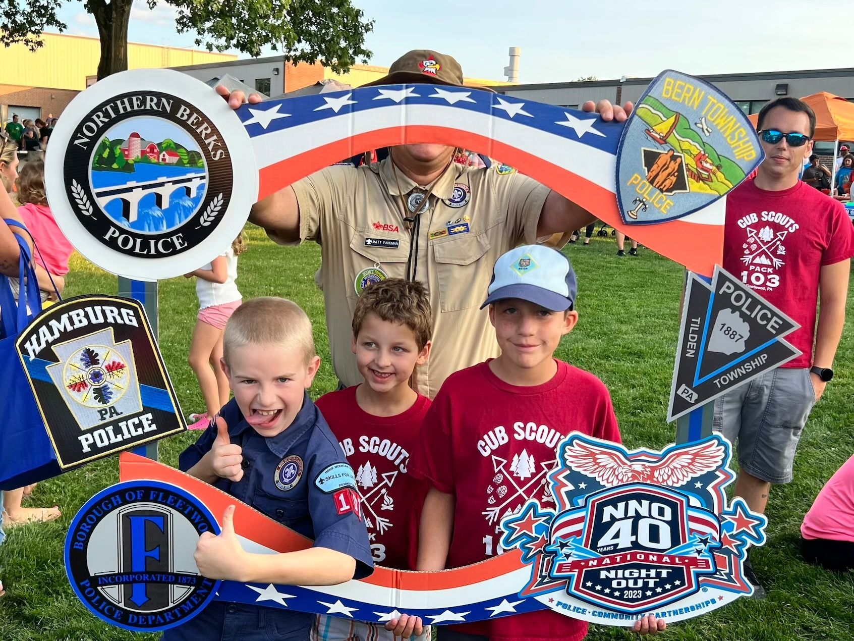 A group of young boys are posing for a picture in a picture frame.