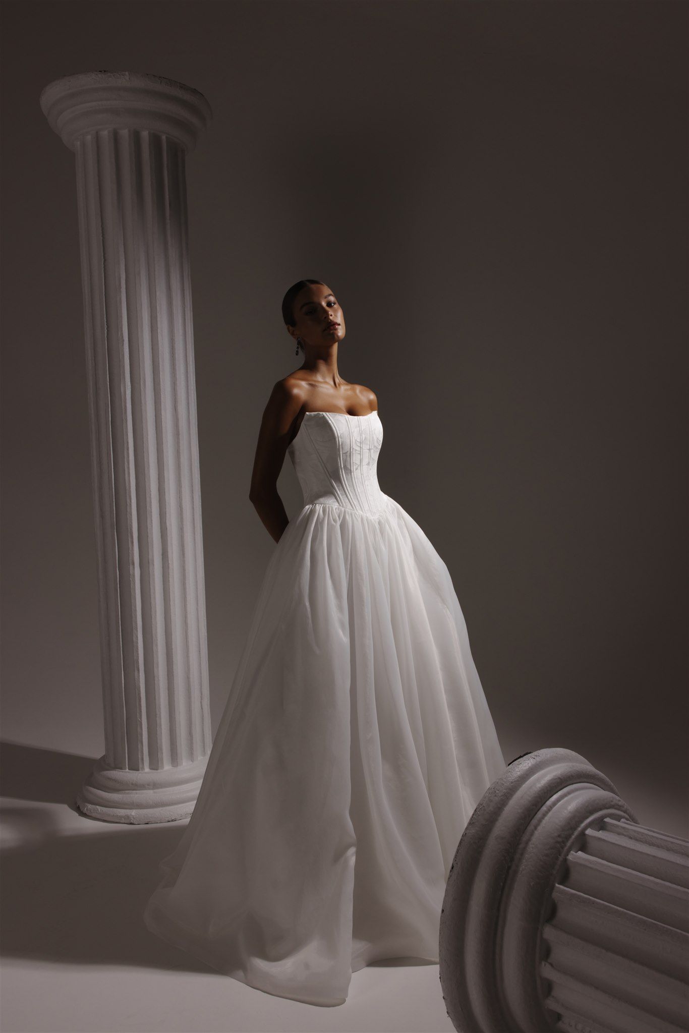 Wedding gown with a tight corset-like bodice and puffy skirt
