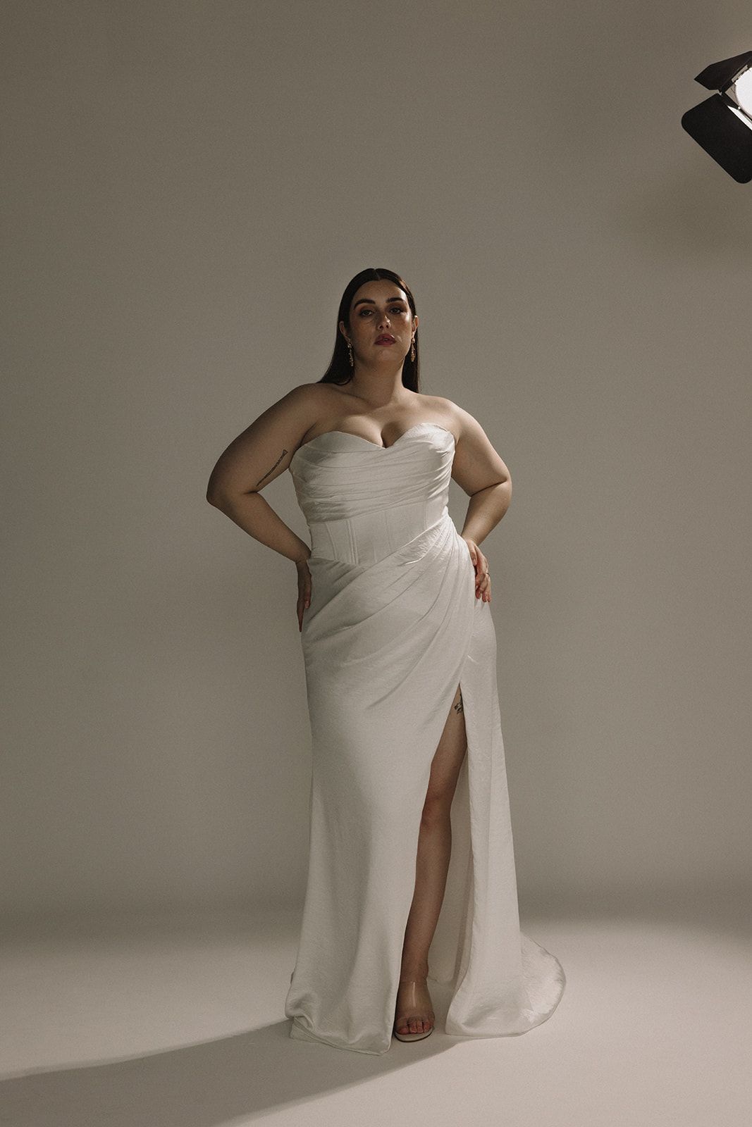 Crushed satin sleeveless wedding gown with leg slit