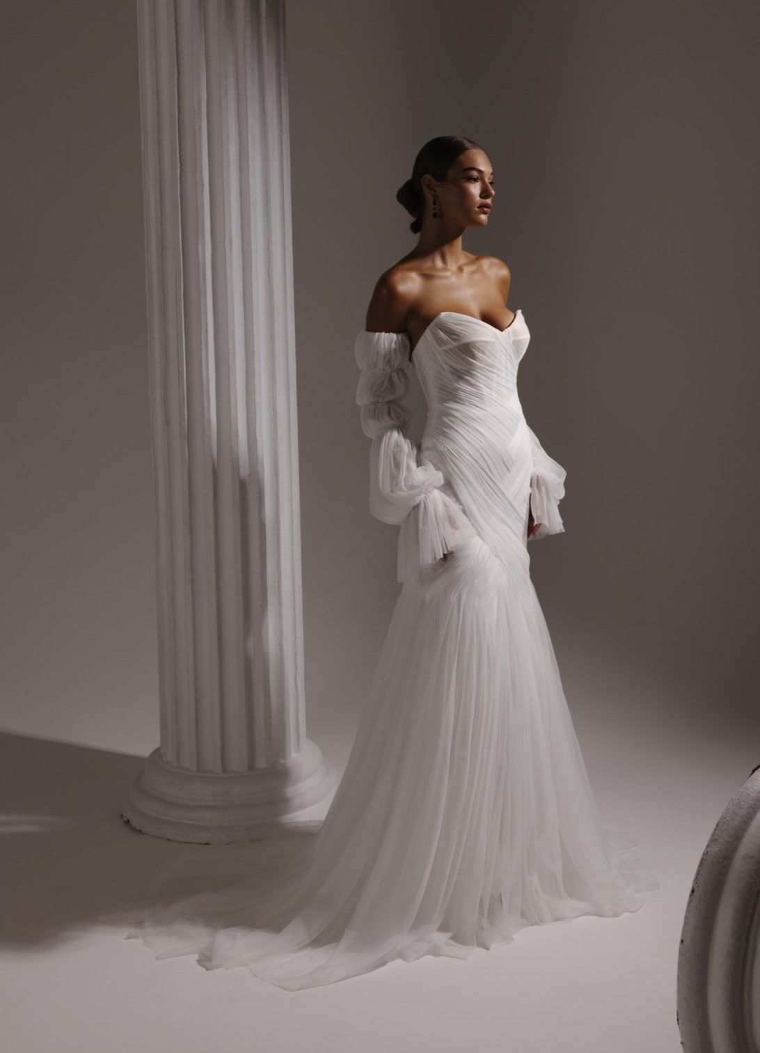 Unique wedding gown with criss-crossing elements and textured fabric