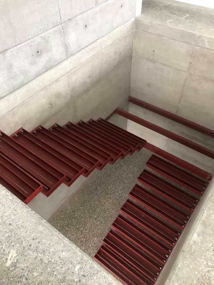 A Set of Stairs Leading Up to a Concrete Floor in a Building — Burke Metal Fabrication In Taree, NSW