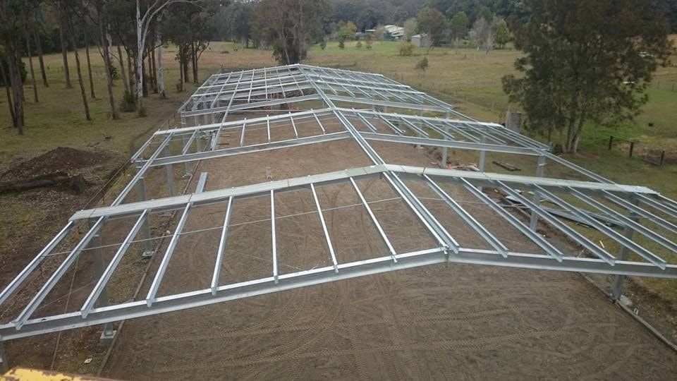 A Large Metal Structure is Being Built in a Field — Burke Metal Fabrication In Taree, NSW