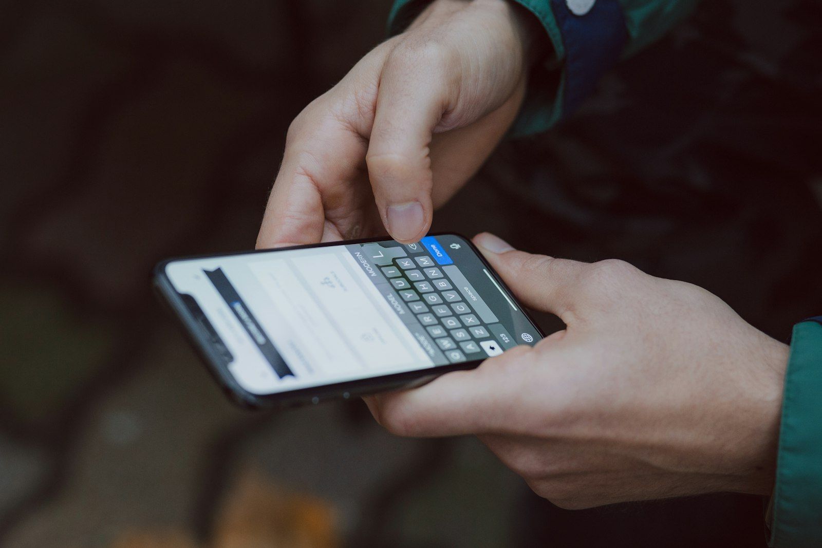 Person using a smartphone to send a message