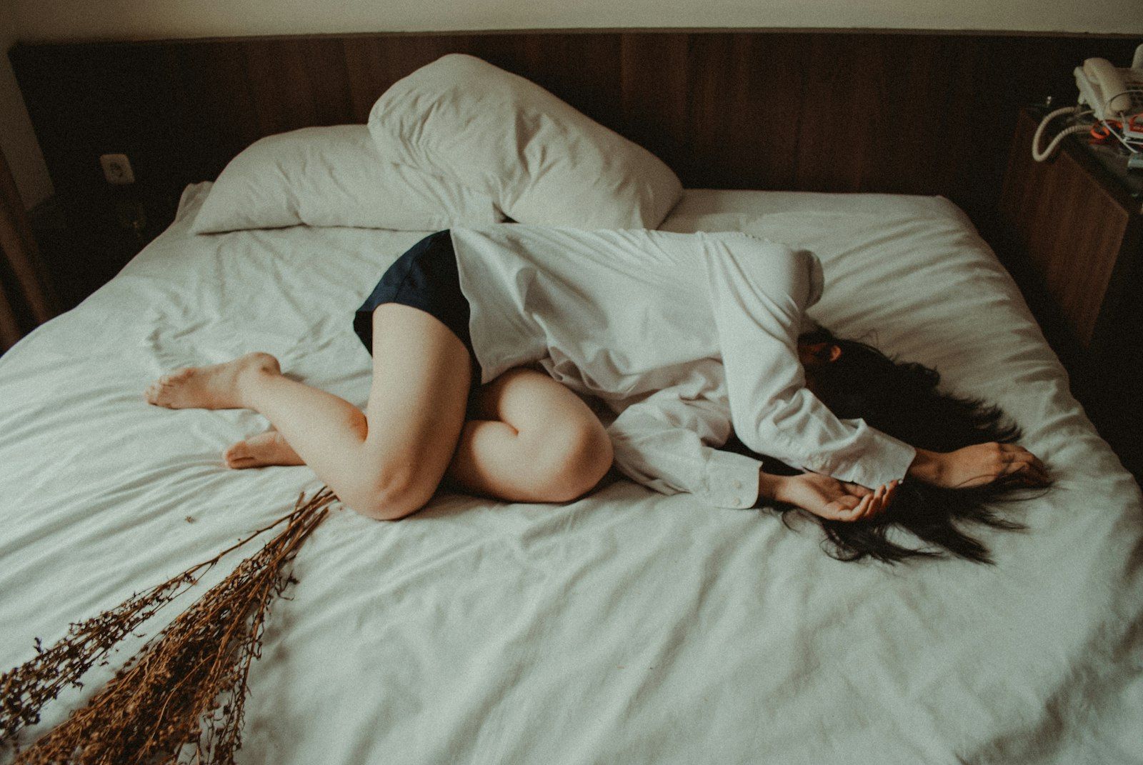 Woman lying in bed resting