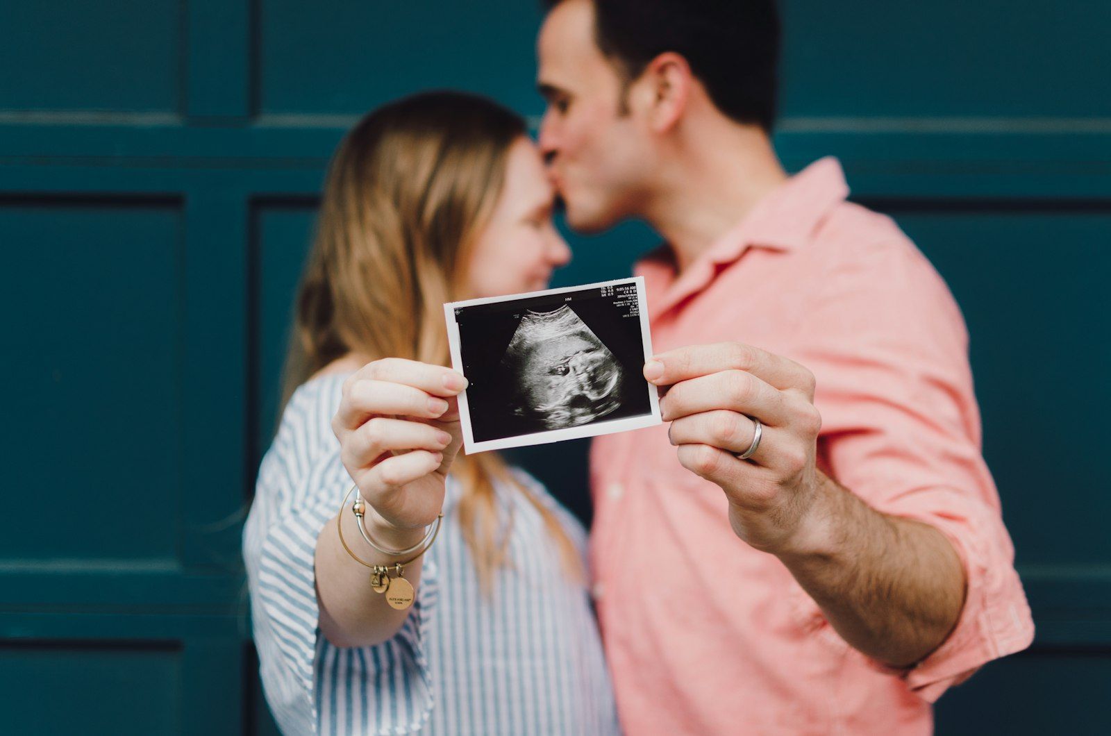 Couple holding an ultrasound photo