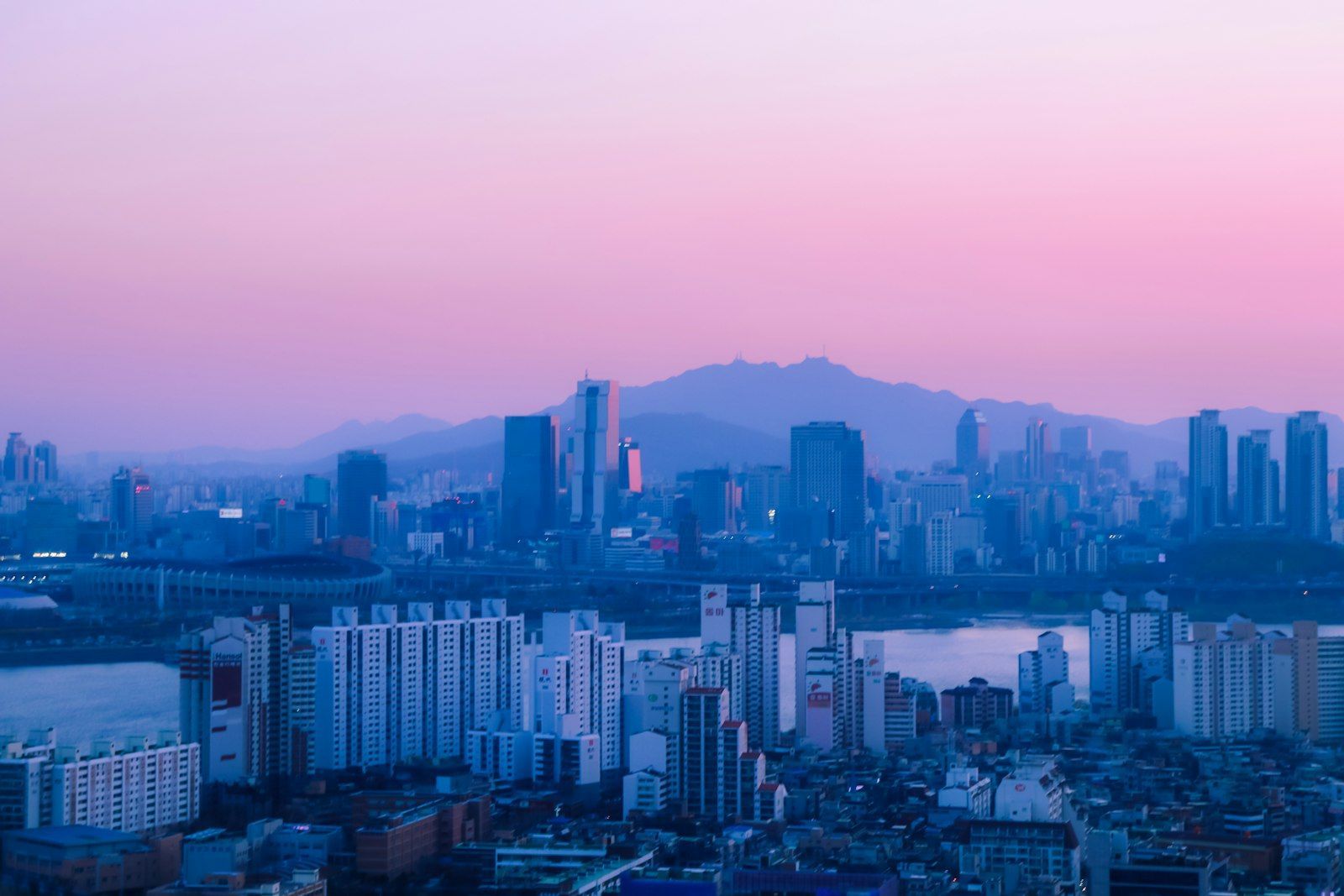 City skyline with a river at sunset