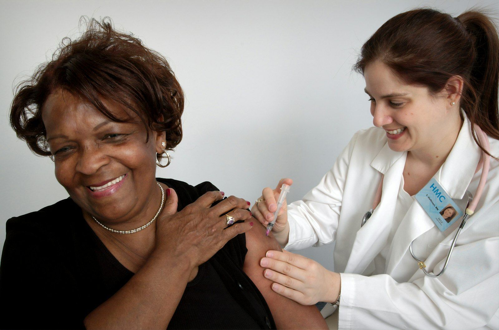 Woman receiving a vaccine in the arm