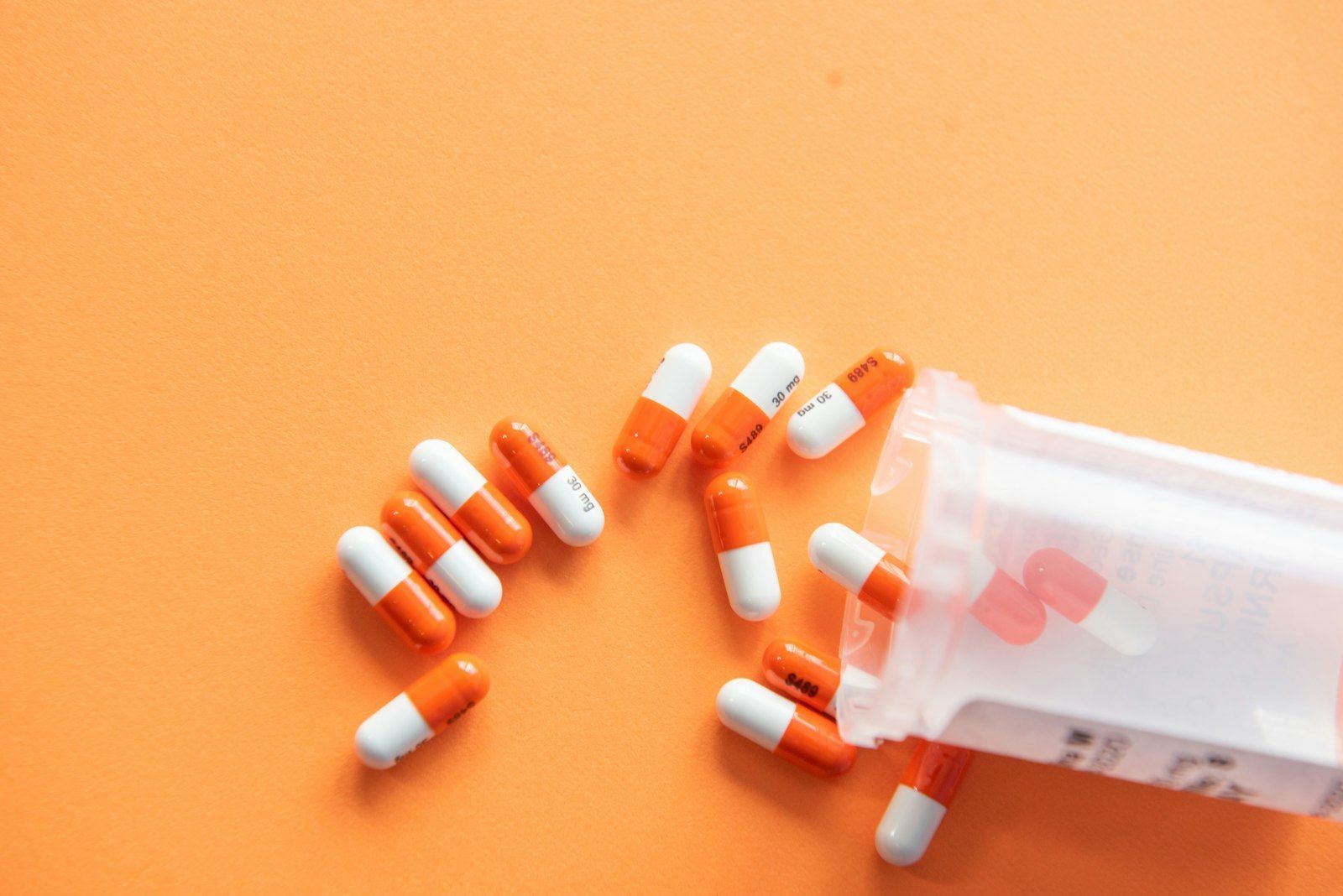 Tablets and capsules on a surface