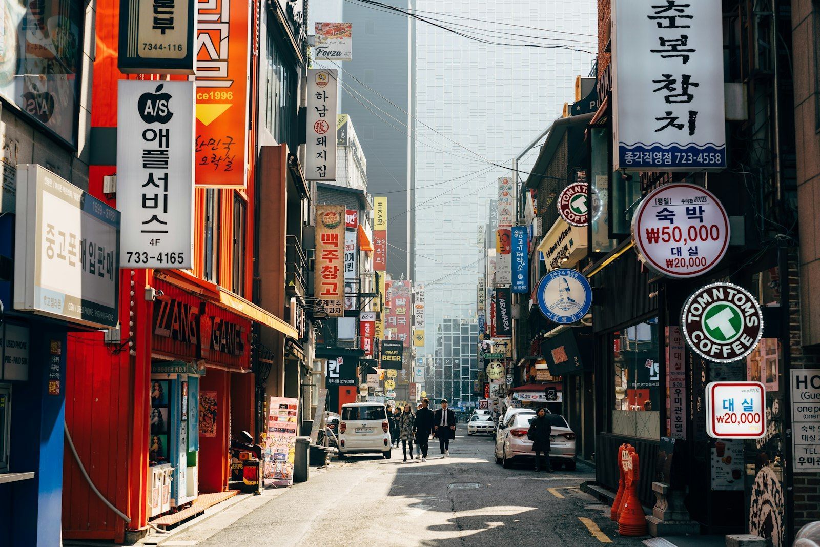 People walking on a city sidewalk
