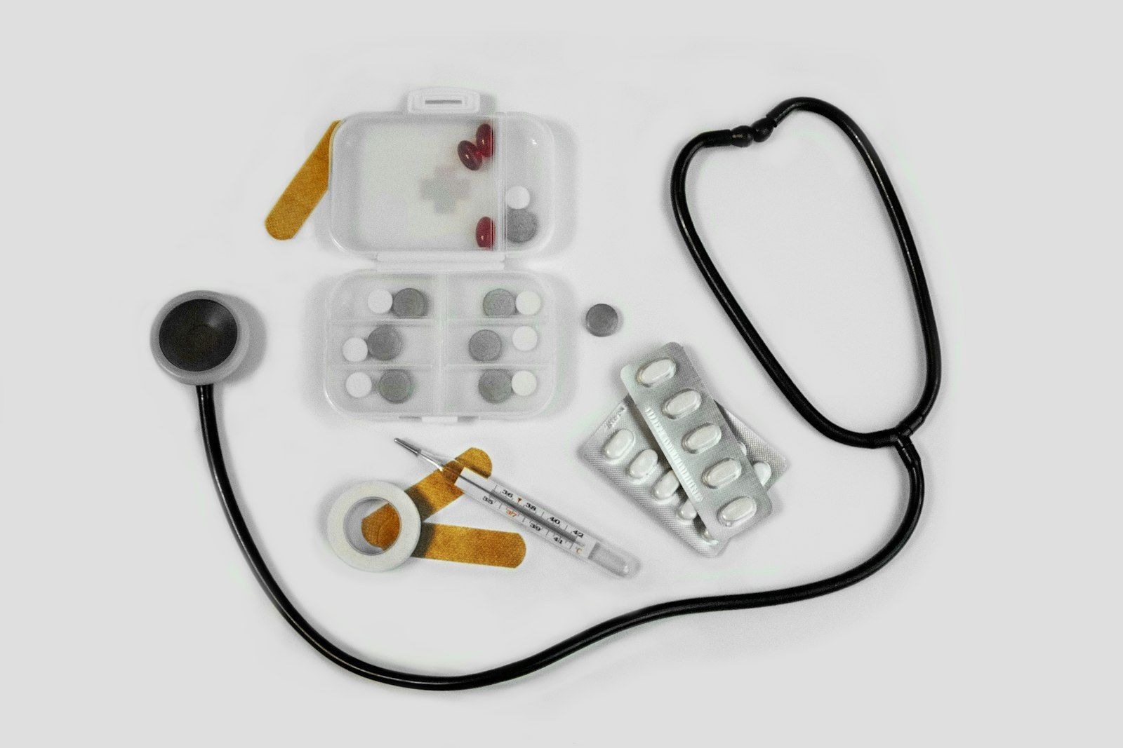 Stethoscope, pill organizer and medical supplies