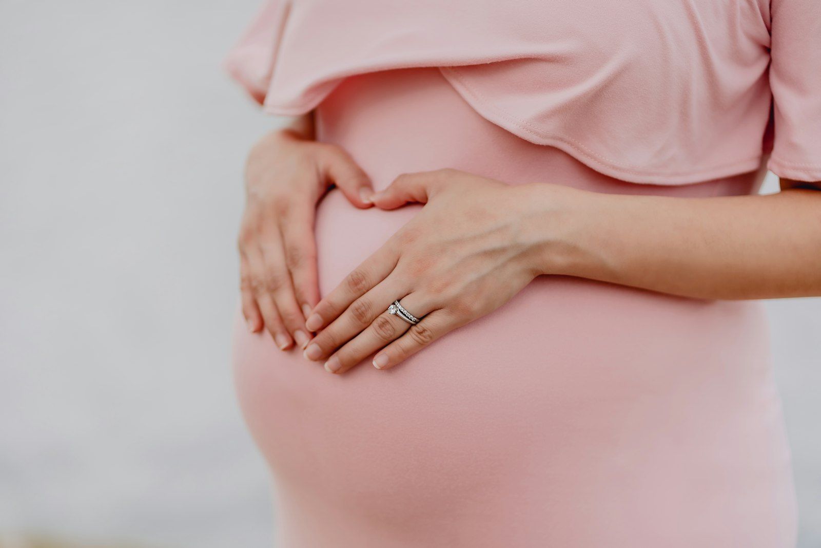 Pregnant woman in a pink dress