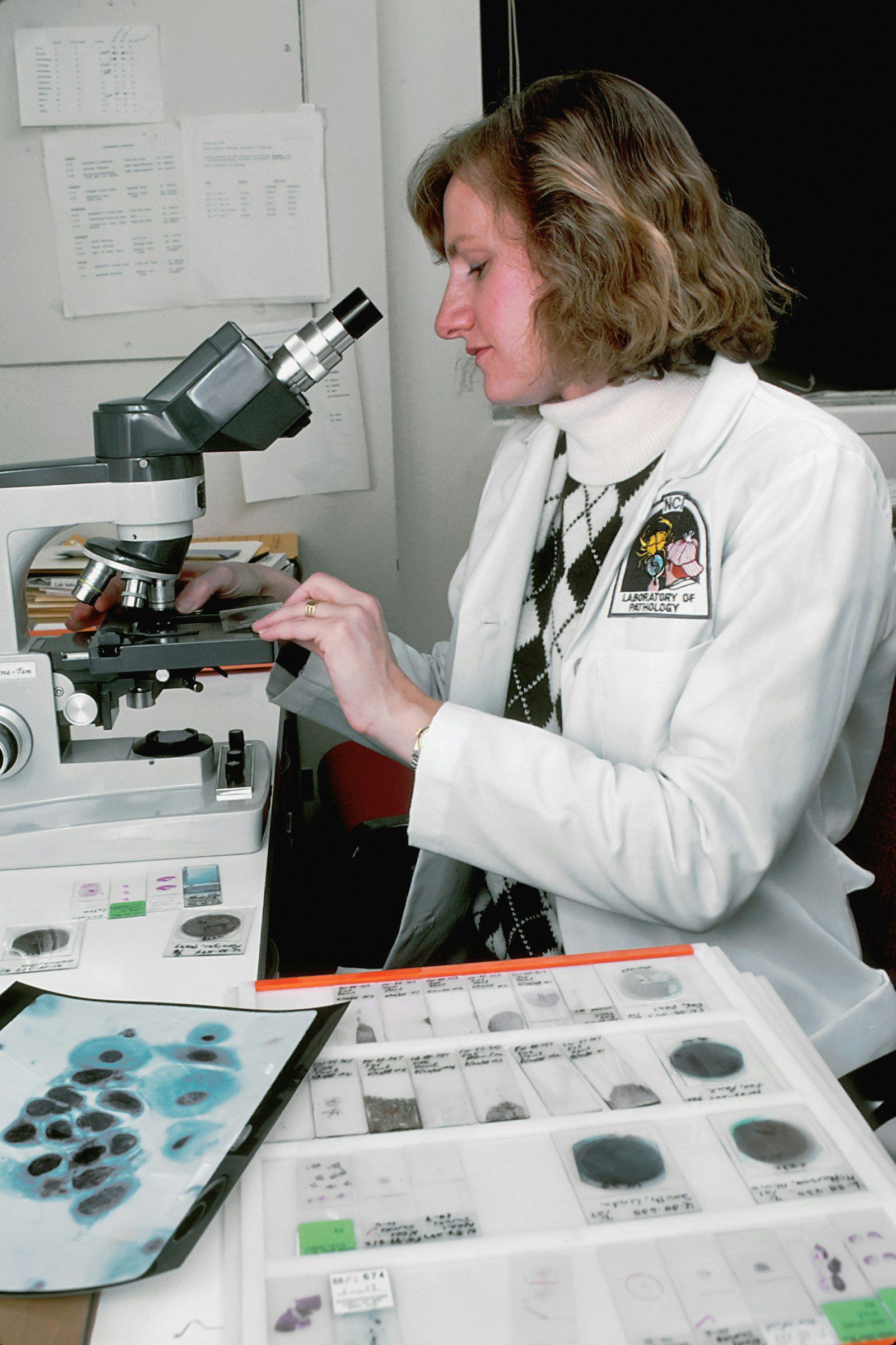 Medical professional using laboratory equipment