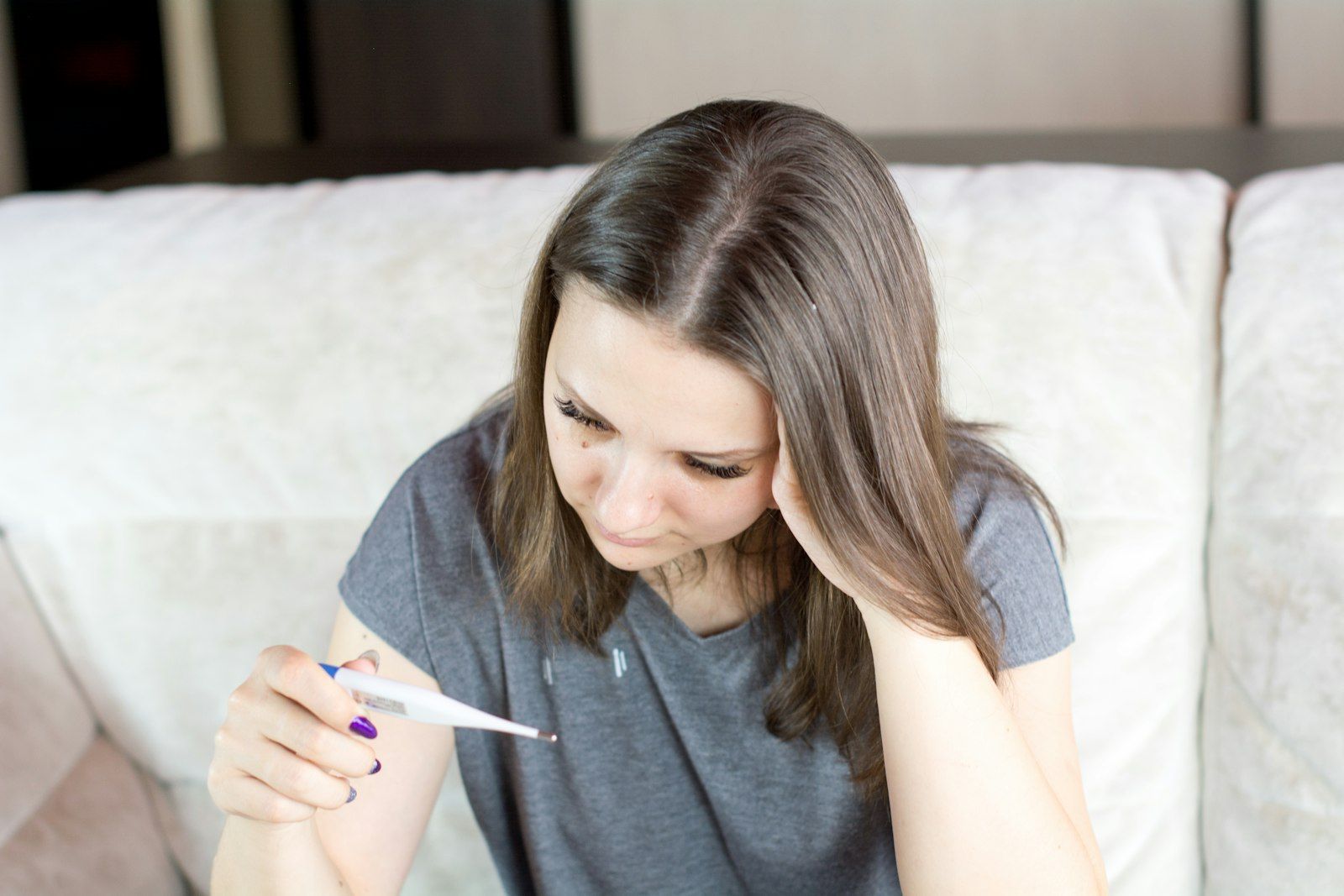 Woman taking notes on a sofa