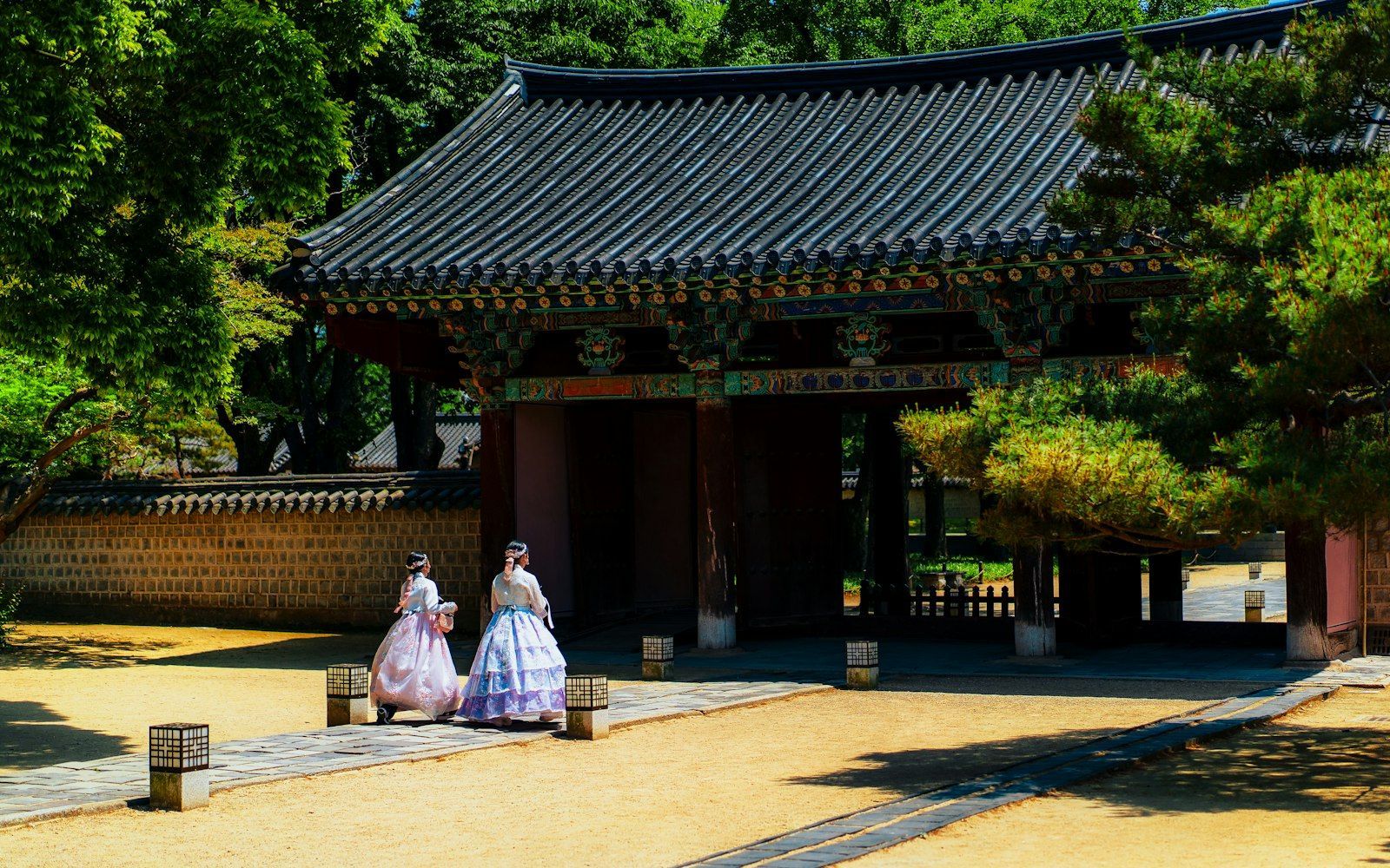 Two women walking along a street