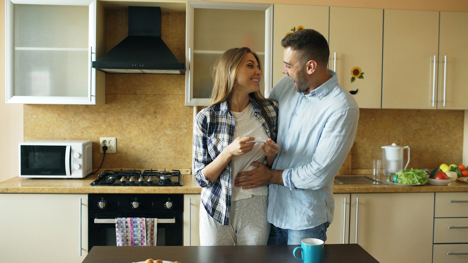 Couple hugging at home