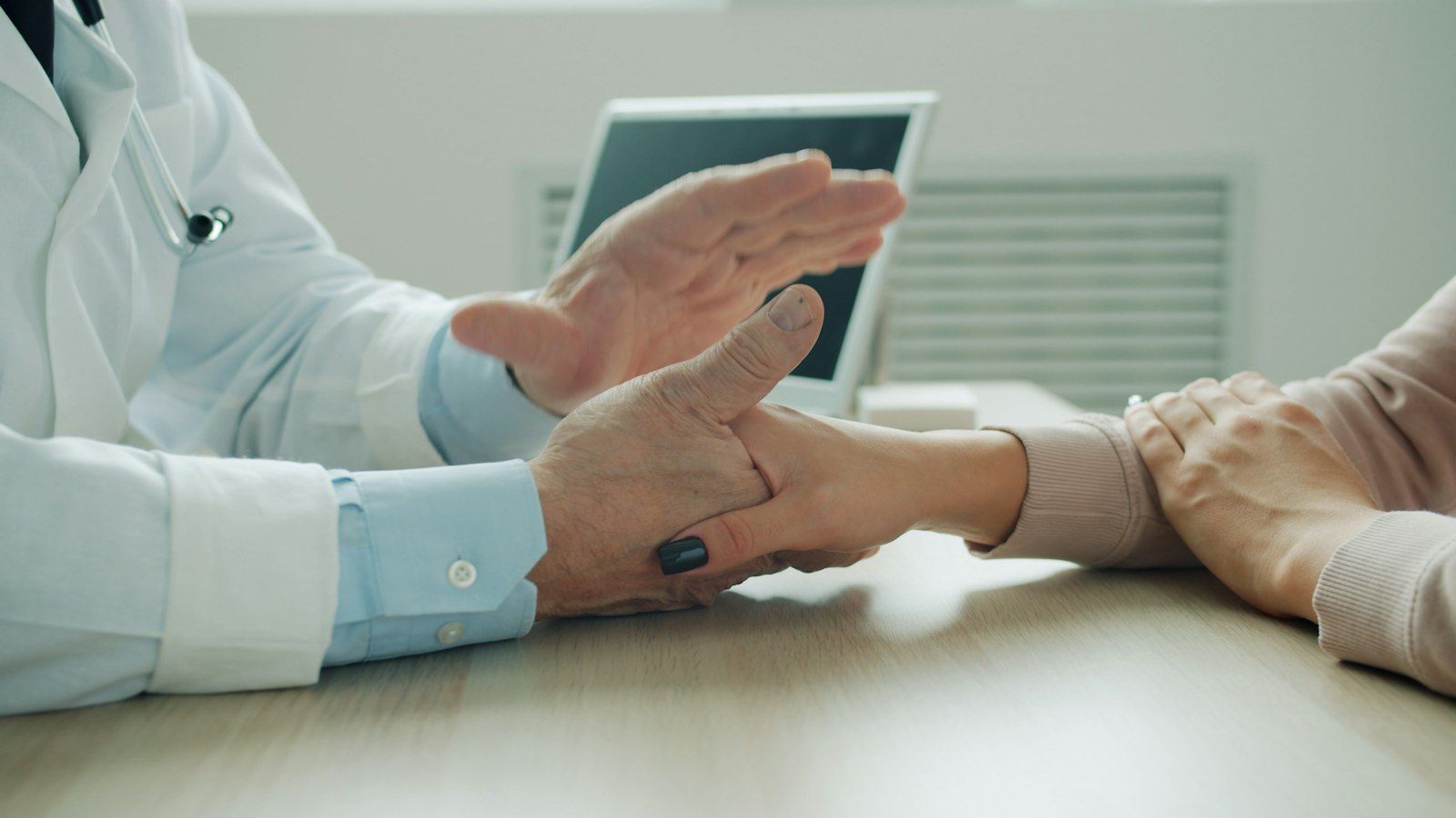 Doctor comforting a patient