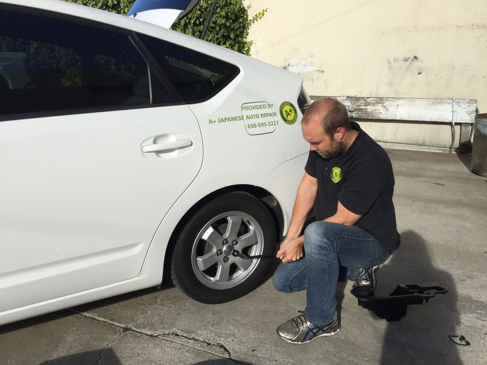 Changing tire | A+ Japanese Auto Repair, Inc.