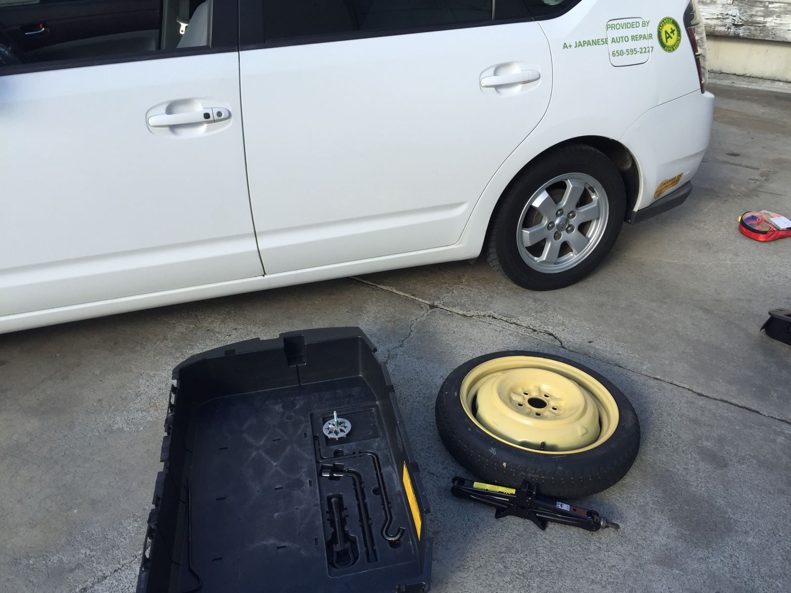 Changing tire | A+ Japanese Auto Repair, Inc.