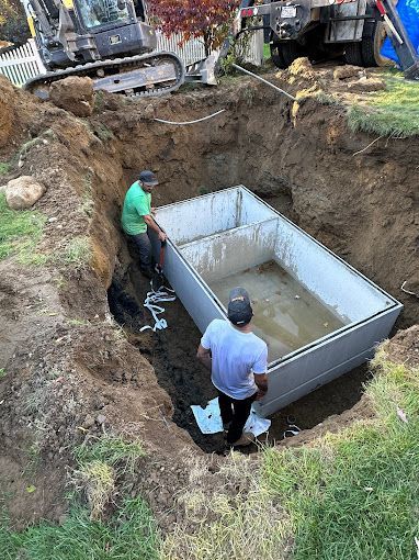 CleanSeptics crew performing septic system maintenance