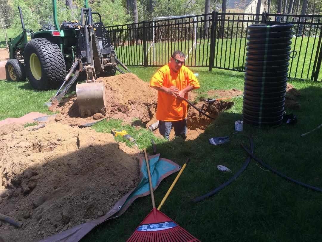 CleanSeptics crew performing septic system maintenance