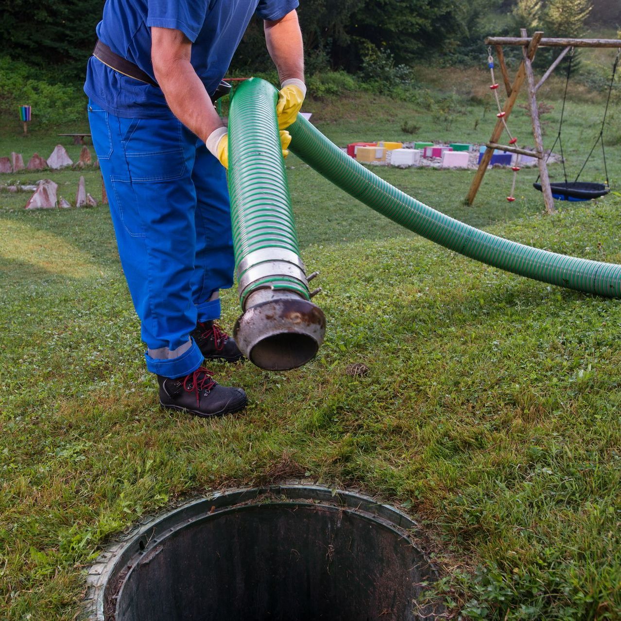 Technician operating septic system pump truck