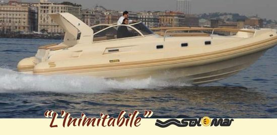 A boat that says l' inimitabile on it
