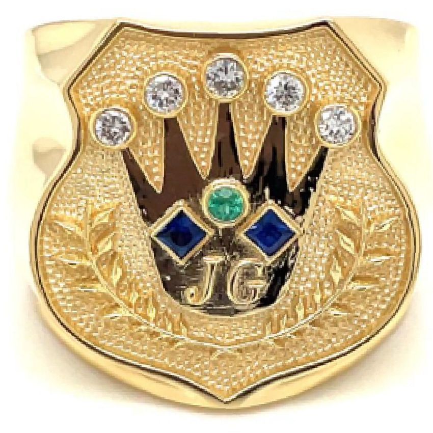 A gold ring with a hand and a crown on it