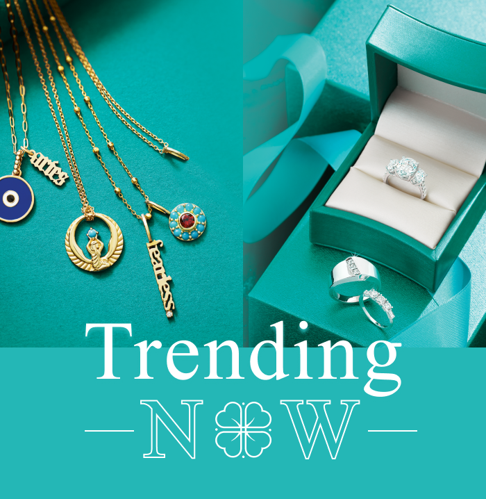 A picture of a necklace and a ring with the words trending now
