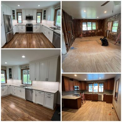 A room with gray wood-look flooring, dark wood cabinets with under-cabinet lighting, and a wall painting of a city scene.