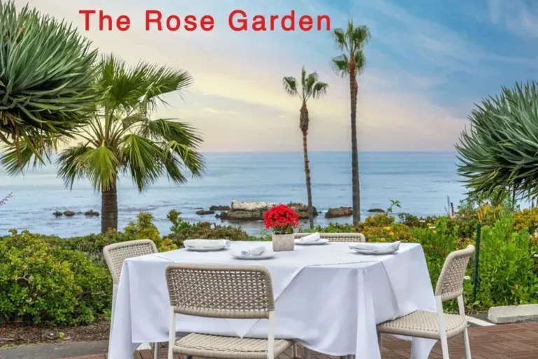 A table and chairs in front of the ocean at Las Brisas in Laguna Beach