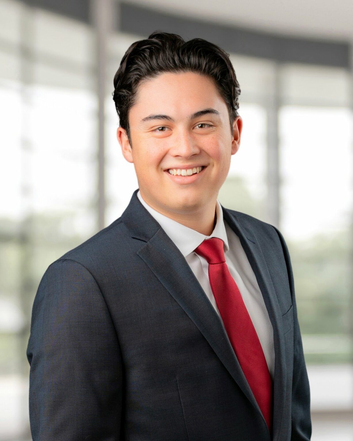 indoor corporate headshot male — studio corporate portrait with clean background and professional attire