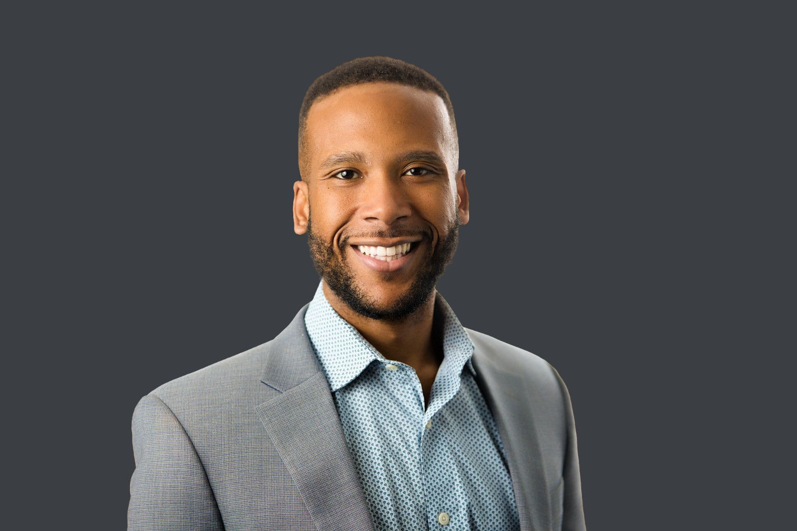 wealth manager irvine ca Male financial advisor professional headshot, neutral grey background, business suit, Christopher Todd Studios, Orange County.