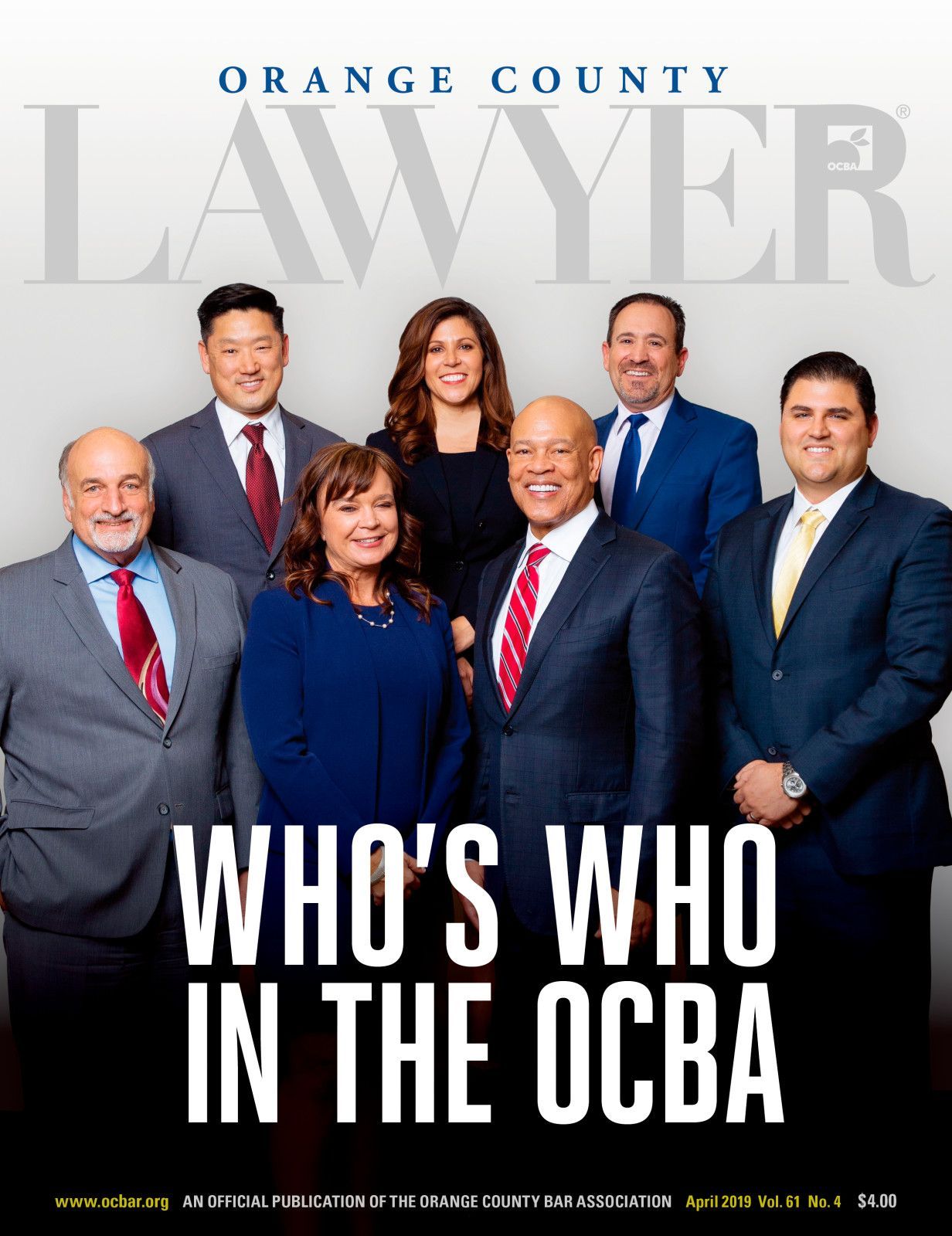 orange county lawyer magazine cover Group of seven professionals in business attire posing for the cover of Orange County Lawyer magazine.
