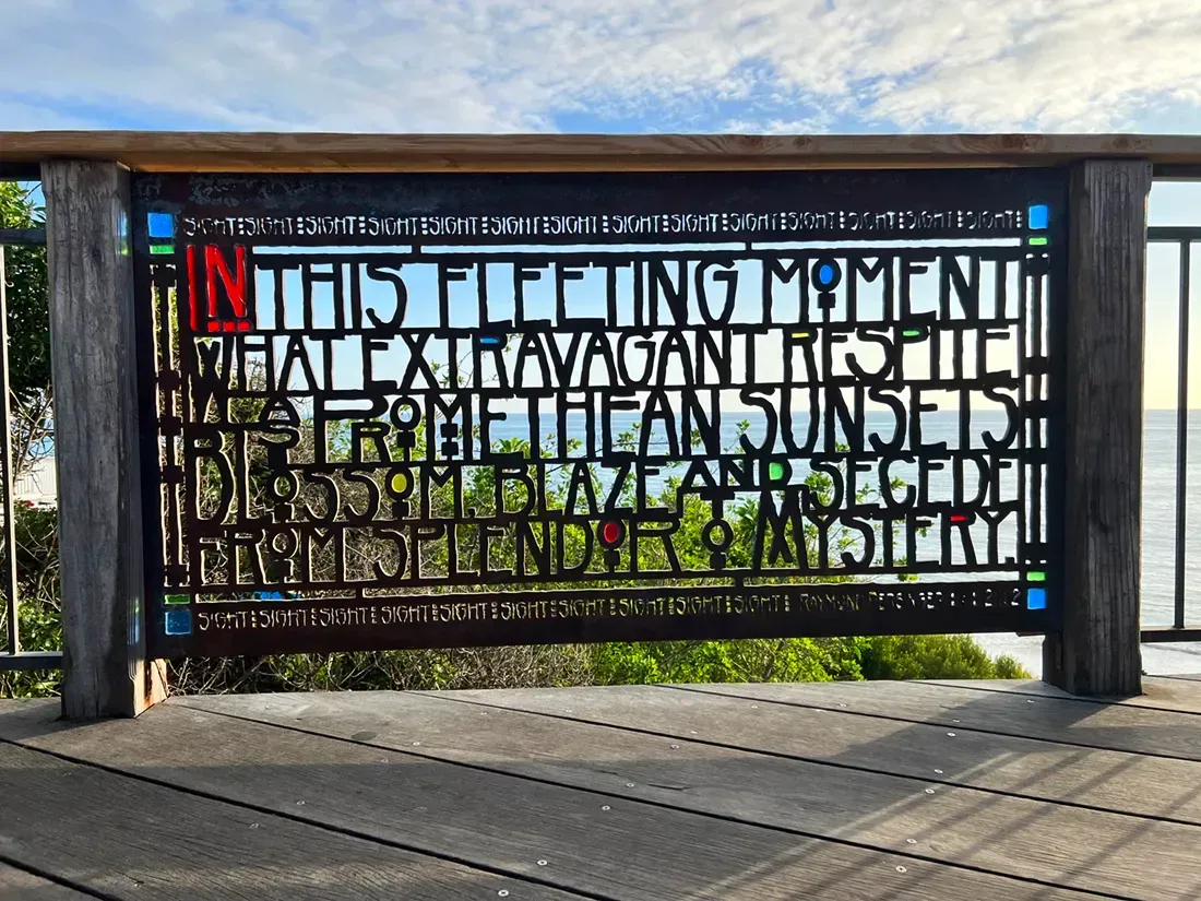 A wooden fence with a stained glass design on it in Laguna Beach