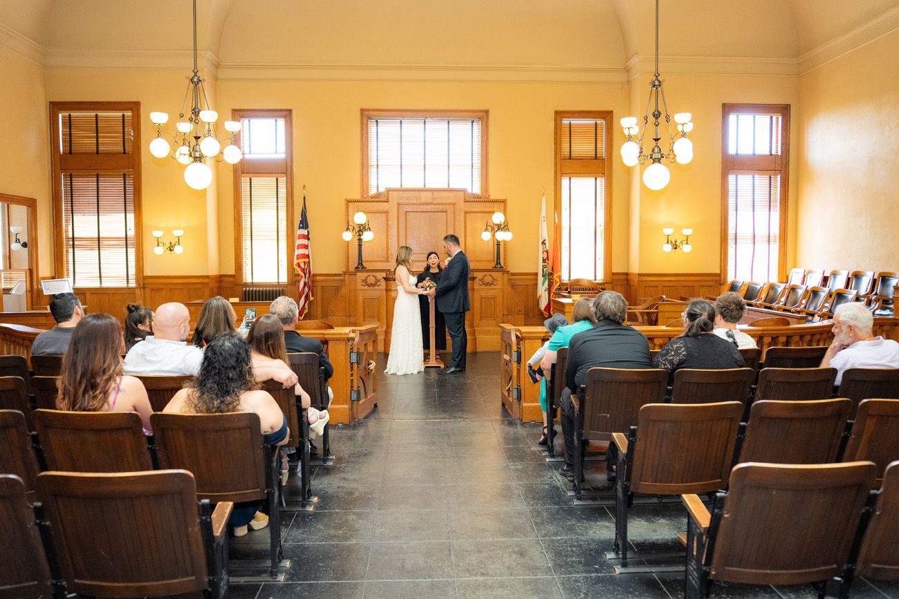 A bride and groom are getting married at the reserved historic courtroom in Santa Ana. 