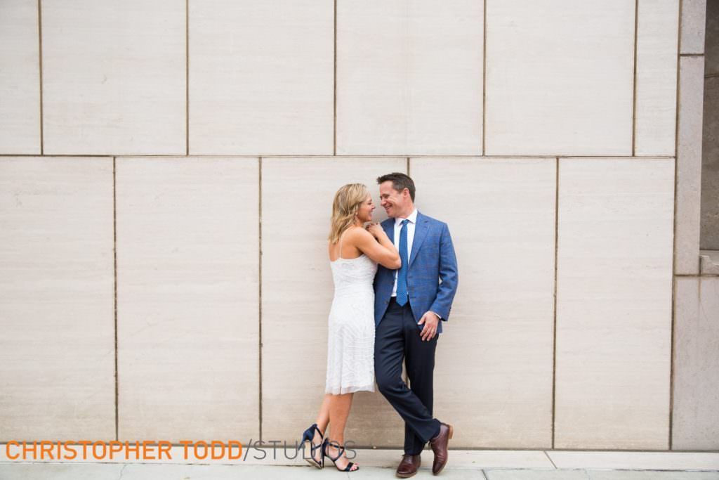 A Bride and Groom are standing next to each other Ronald Reagan Federal Building in Santa Ana