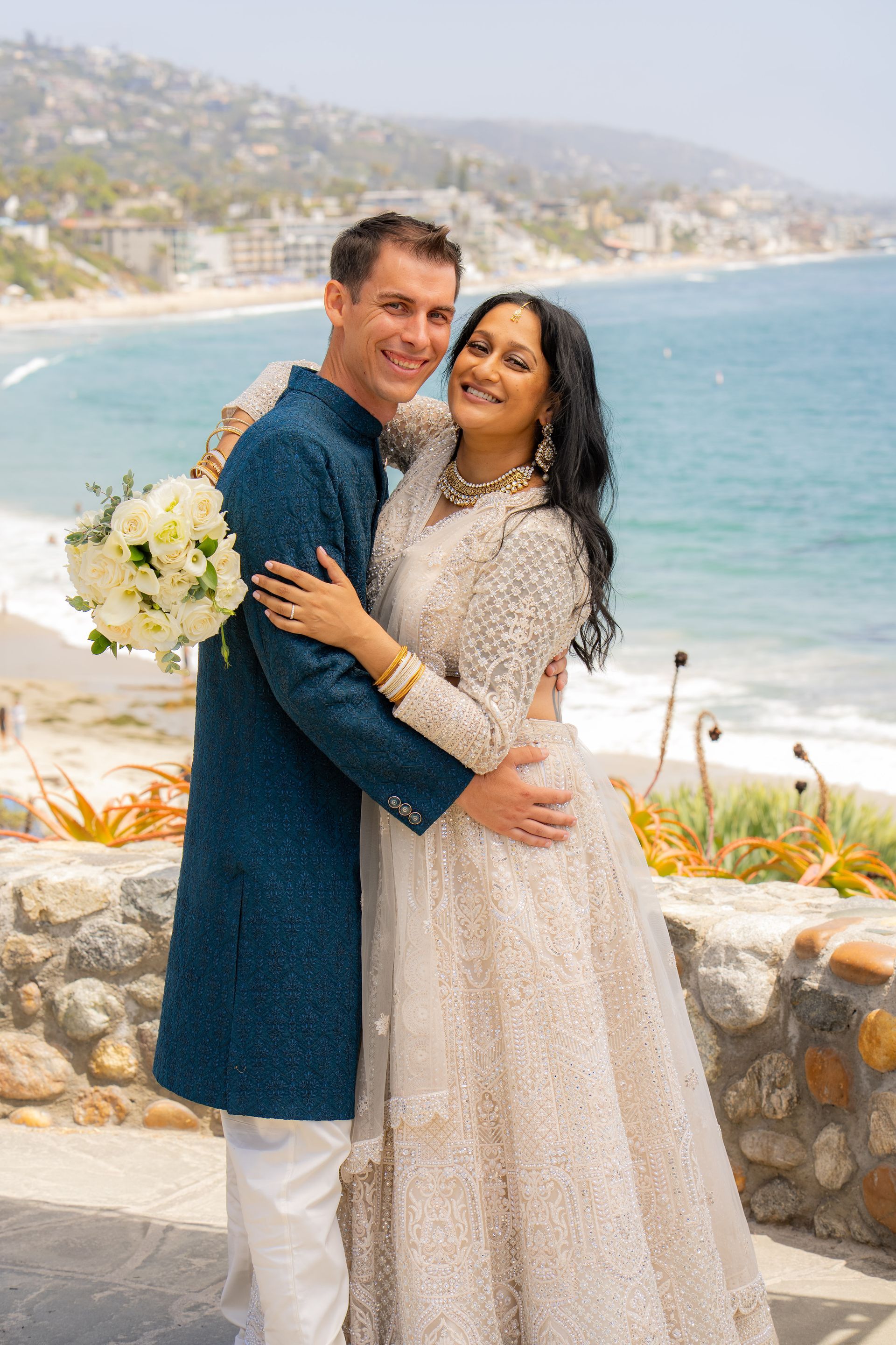Bride and groom after civil ceremony in Laguna beach wearing traditional Indian saree wedding dress