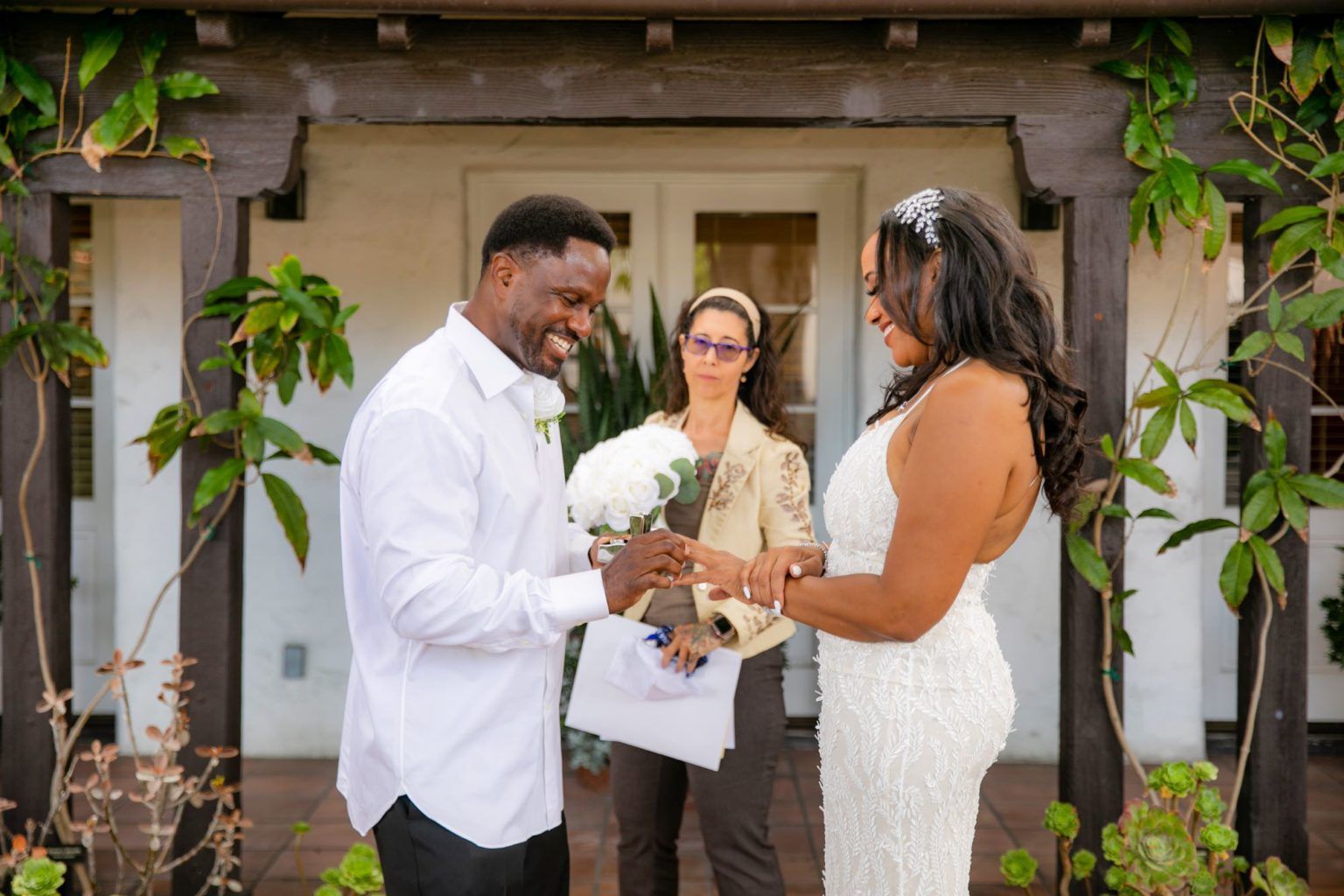 Laguna Beach, City Hall, Wedding couple exchanging rings outside 