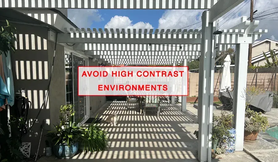 A picture of a pergola with a sign that says `` avoid high contrast environments ''.