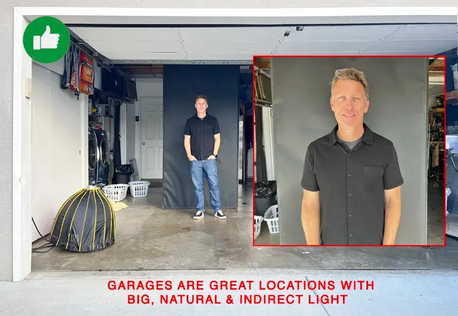 A man in a black shirt is standing in a garage for a headshot