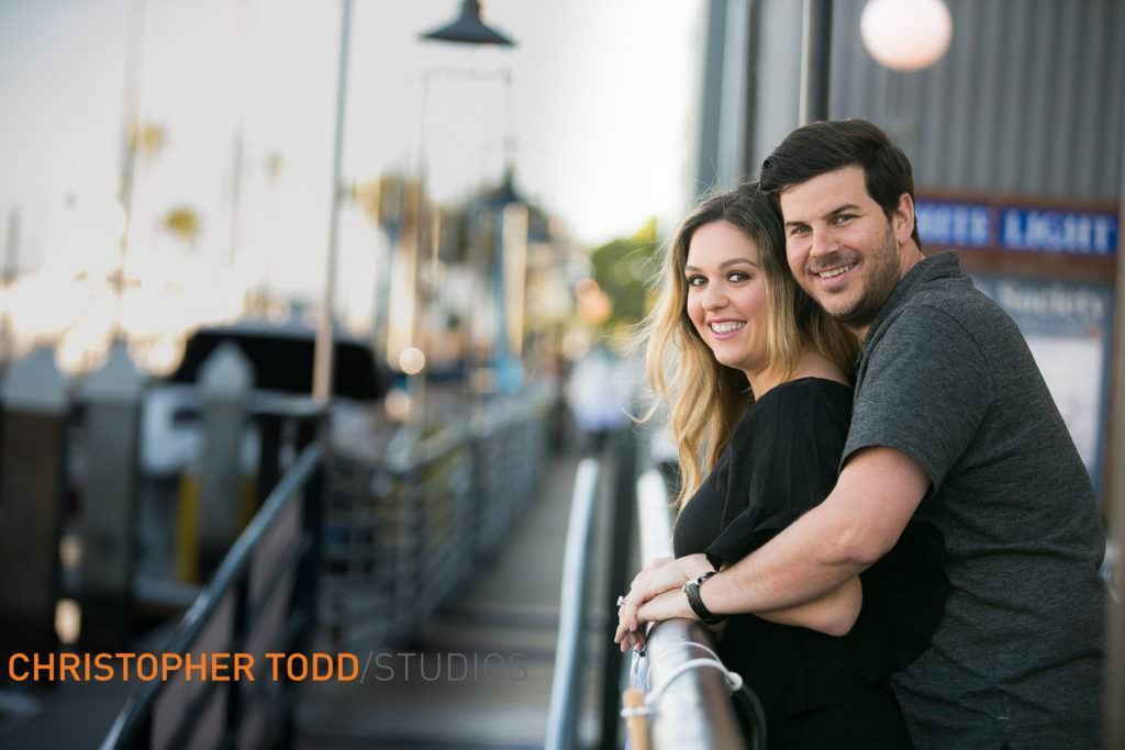 A man and a woman are posing for a picture in front of a building at Lido Marina VIllage