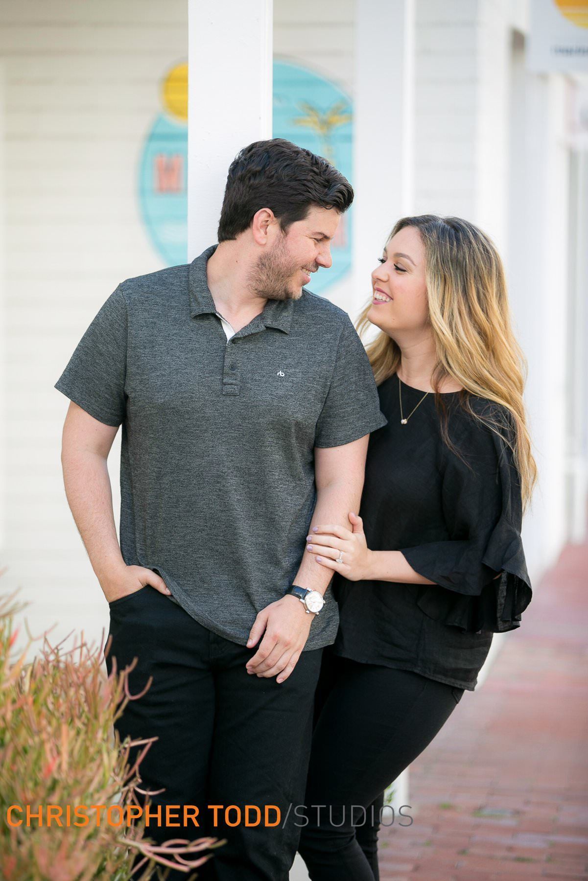 A man and a woman are standing next to each other on a sidewalk at Lido Marina VIllage